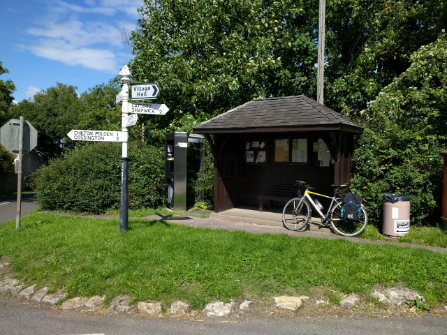 Bus shelter, phone box, rubbish bin and signpost at Edington by Rob Purvis